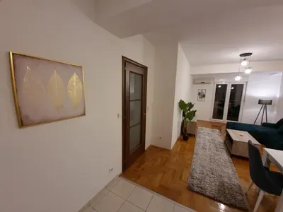 a living room with a couch and a table at Big apartment in Podgorica