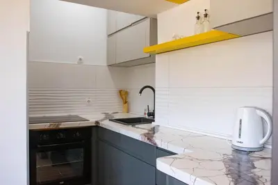 a kitchen with a sink and a counter top at Campi d’Oro in Kotor