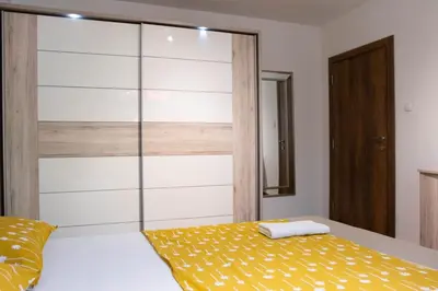 a bedroom with a bed with a glass wall at Campi d’Oro in Kotor