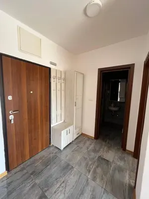 an empty room with a door and a bathroom at Z apartment in Podgorica