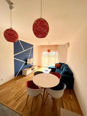 a living room with a table and a couch at Z apartment in Podgorica