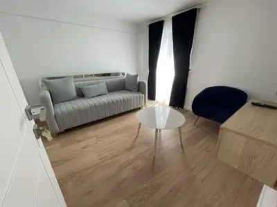 a living room with a couch and a table at Lungomare Apartments in Petrovac na Moru