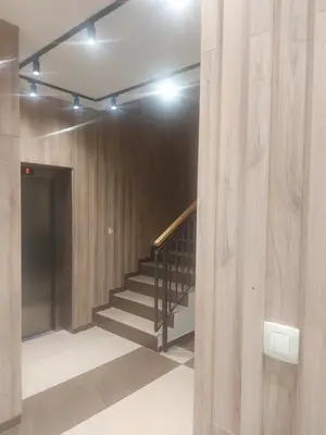 a hallway with a staircase in a building at Oscar in Podgorica
