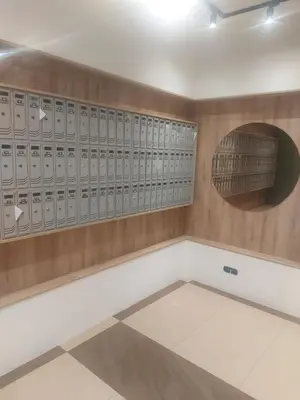 a room with rows of lockers on a wall at Oscar in Podgorica