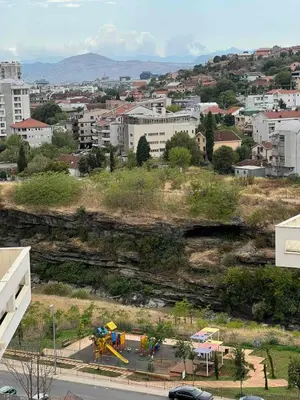 a view of a city with a playground and buildings at Oscar in Podgorica