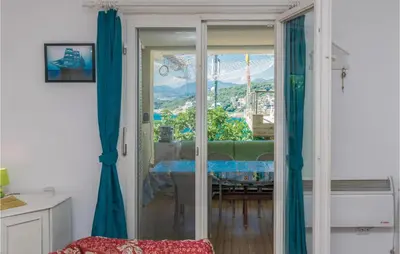 a room with a sliding glass door with a view at Nice Apartment In Utjeha With Kitchen in Utjeha