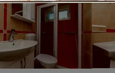 a bathroom with a toilet and a sink at Nice Apartment In Utjeha With Kitchen in Utjeha