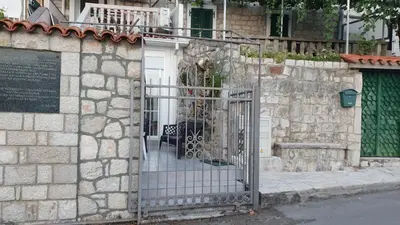 an entrance to a house with a gate at Stone house Djakonovic in Budva