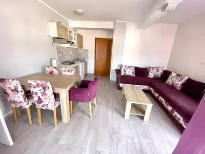 a living room with a couch and a table at Apartments Popović in Budva
