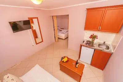 an overhead view of a kitchen with a small table at Guest House Edita in Ulcinj