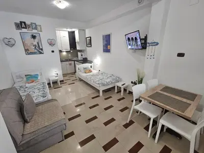 a living room with a couch and a table at Seaview, just across the beach, Bečići in Becici