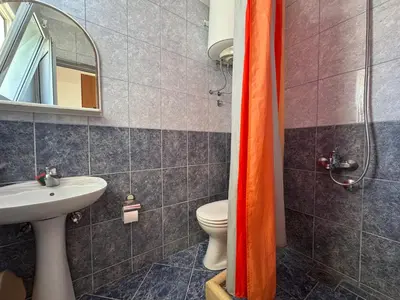 a bathroom with a toilet and a sink at Apartments Marniković in Ulcinj