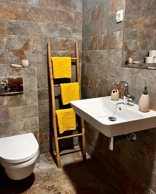 a bathroom with a sink and a toilet at Beach Villa Žukovica in Radanovići