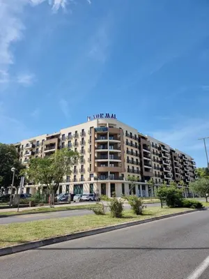 a building with the words on the top of it at Fantastic new centre apartment in Podgorica