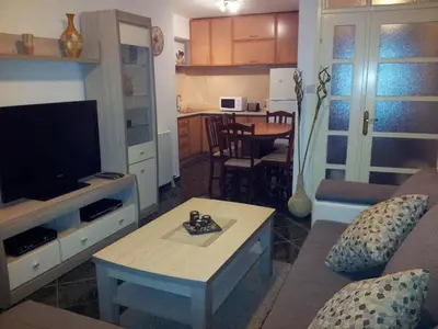 a living room with a couch and a table at Apartments Popovic in Kotor