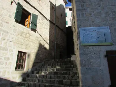 a staircase leading up to a building with a window at Apartments Popovic in Kotor