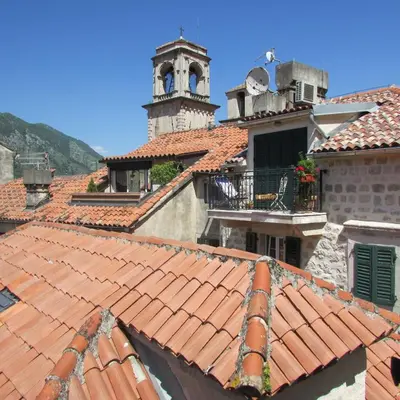 an overhead view of a building with red tile roofs at Apartments Popovic in Kotor