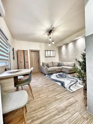 a living room with a couch and a table at Apartment Aki in Kotor