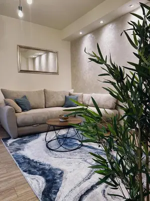 a living room with a couch and a table at Apartment Aki in Kotor