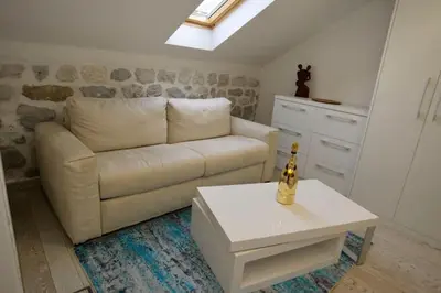 a living room with a couch and a table at Waterfront Villa in Muo in Kotor