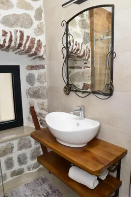 a bathroom with a white sink and a mirror at Waterfront Villa in Muo in Kotor