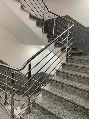 a set of stairs with a metal railing at Apartment Poetica Del Mare, Budva, Bečići in Becici