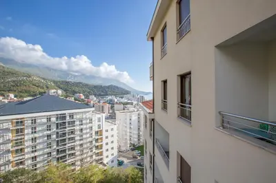 a view of a city from a building at Apartment Poetica Del Mare, Budva, Bečići in Becici