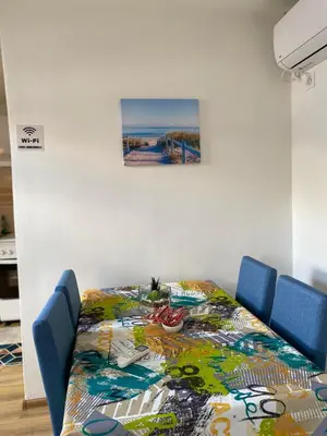 a table with a colorful table cloth on it at Apartman Vucinic in Cetinje