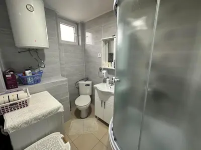 a bathroom with a shower and a toilet and a sink at Apartman Vucinic in Cetinje