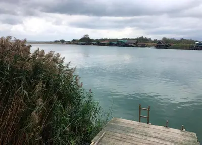 a view of a lake with a wooden dock at Masa L13 Stasa L14 in Ulcinj