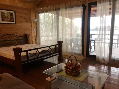 a living room with a bed and a glass table at Masa L13 Stasa L14 in Ulcinj