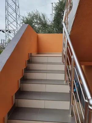 a set of stairs leading up to a building at Apartmen Kuca za odmor i familiju in Bar