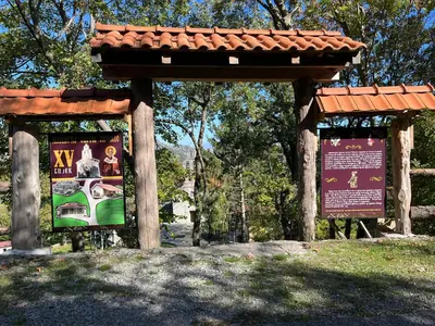 a park with a sign in the grass at Bed & Wine Djonovic in Virpazar