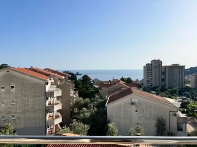 a view of a city with buildings and the ocean at Просторная квартира в Петровце с видом на море in Petrovac na Moru
