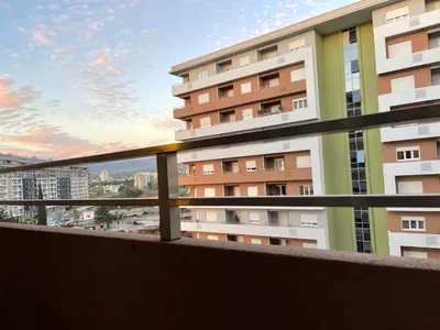 a balcony with a view of a building at Apartment in Central Point in Podgorica