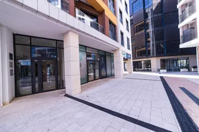 an empty street in front of a building at Elite apartments Podgorica in Podgorica