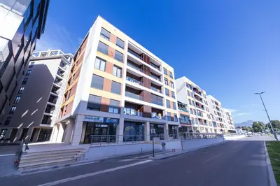 an empty street in front of a building at Elite apartments Podgorica in Podgorica