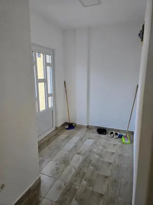 an empty room with two mop at Apartman Tološi in Podgorica