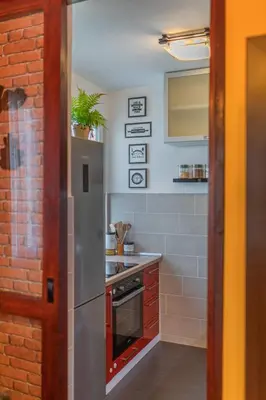 a kitchen with a refrigerator and a stove top oven at Beni Apartment in Bar