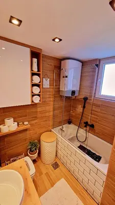 a bathroom with a tub and a toilet and a sink at Beni Apartment in Bar