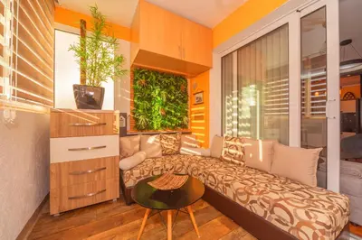 a living room with a couch and a table at Beni Apartment in Bar