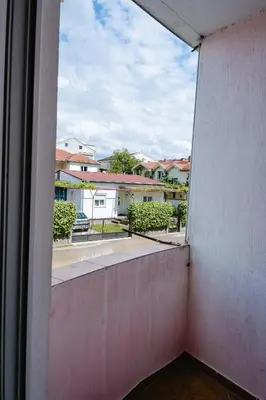 an open window with a view of a street at Stex Urban 1 in Podgorica