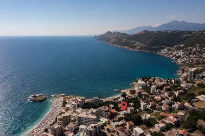 an aerial view of a city next to the ocean at El Pasaja in Dobra Voda