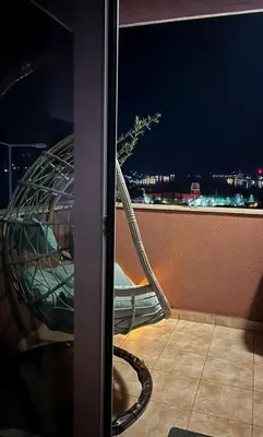 a stair case on a balcony with a view of the city at Sea view apartment in Kotor ! Apartment Popica in Kotor