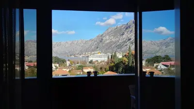 a view of a mountain from a window at Sea view apartment in Kotor ! Apartment Popica in Kotor