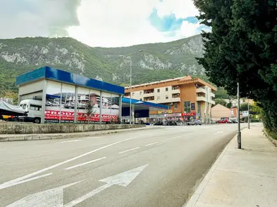 an empty street with a building and a mountain at Sea view apartment in Kotor ! Apartment Popica in Kotor