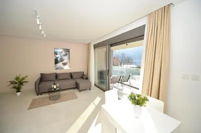 a living room with a couch and a table at Solaris Lux Apartments in Kotor