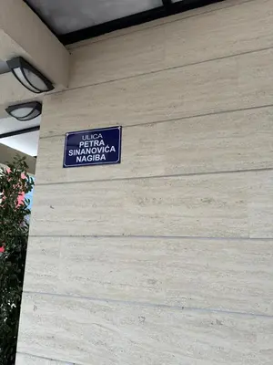 a sign on the side of a building at Delta apartment City kvart in Podgorica