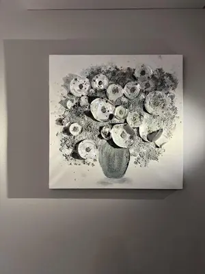 a painting of a vase of skulls on a wall at XIO Apartments in Bar