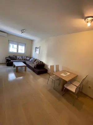 a living room with a couch and a table at Apartment CK in Podgorica